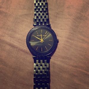 Black and gold Michael Kors watch